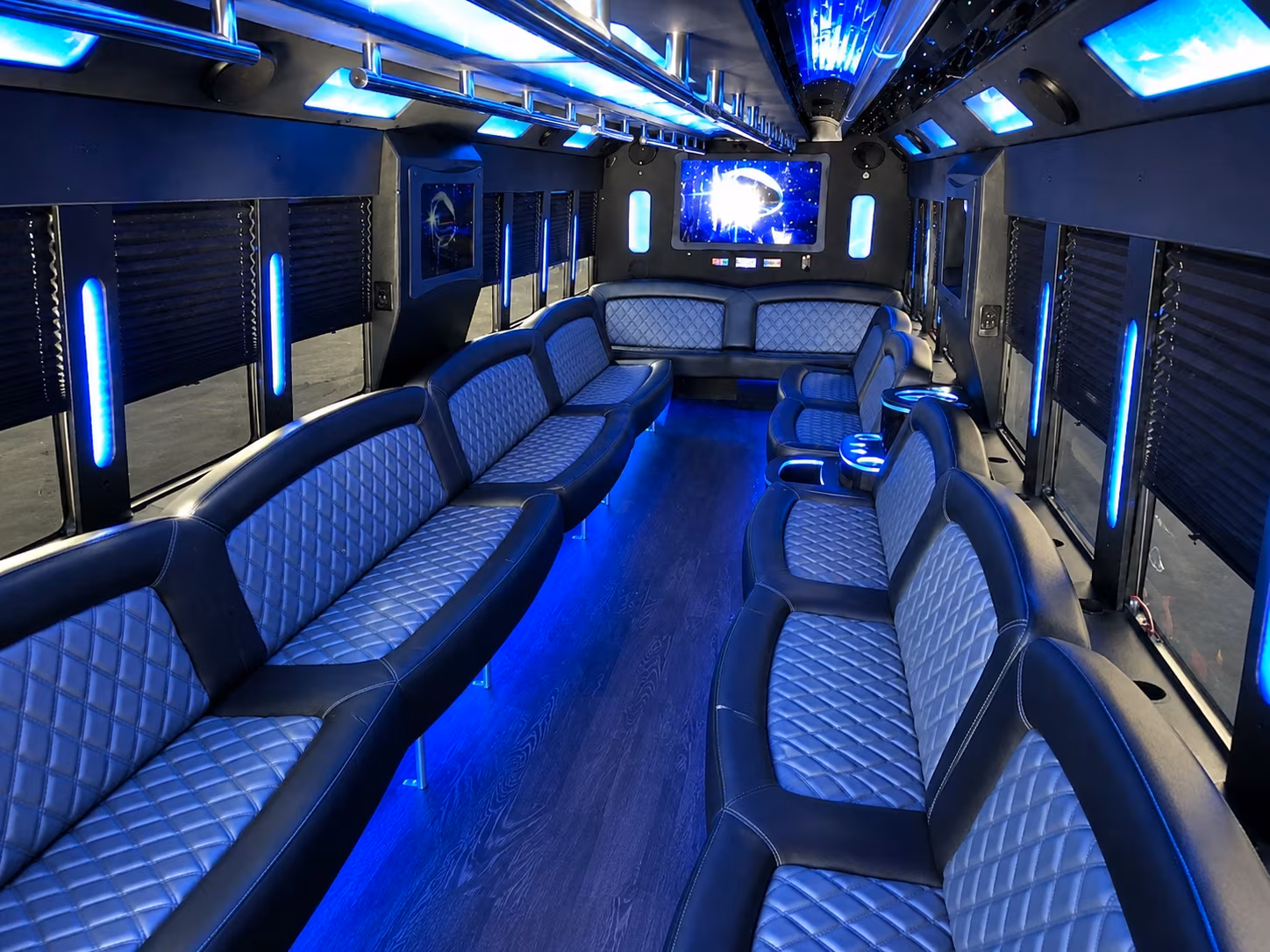 Friends laughing during a party bus celebration in Long Beach